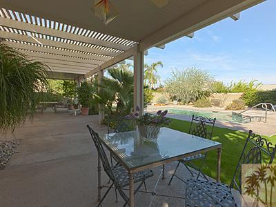 5 White Sun Way Rancho Mirage, CA 92270 - Photo 21 of 24 a view of a patio with a table chairs and a table