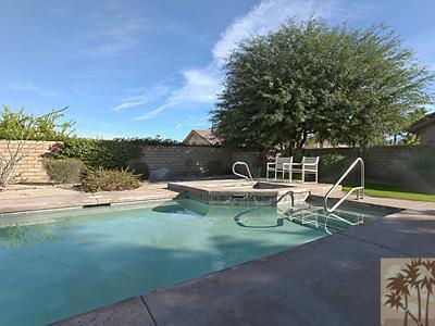 5 White Sun Way Rancho Mirage, CA 92270 - Photo 24 of 24 a view of a water with lawn chairs and a fire pit