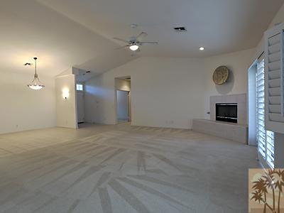 5 White Sun Way Rancho Mirage, CA 92270 - Photo 6 of 24 an empty room with fireplace and windows
