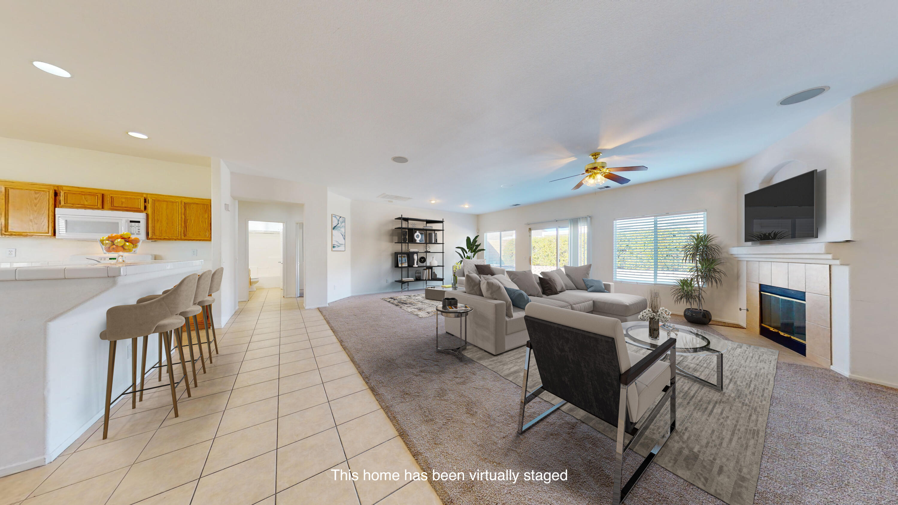 83276 Greenbrier Drive Indio, CA 92203 - Photo 3 of 12 a living room with fireplace furniture and a flat screen tv