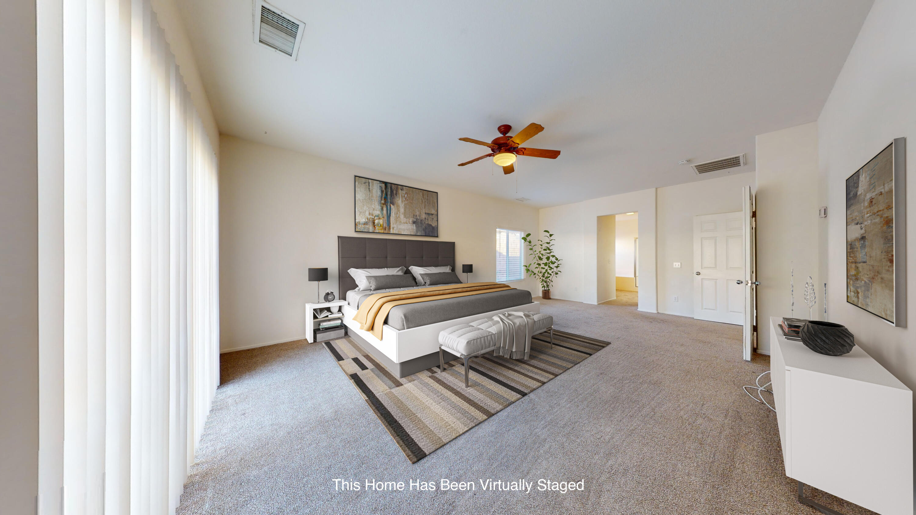 83276 Greenbrier Drive Indio, CA 92203 - Photo 6 of 12 a bedroom with a bed and a chandelier