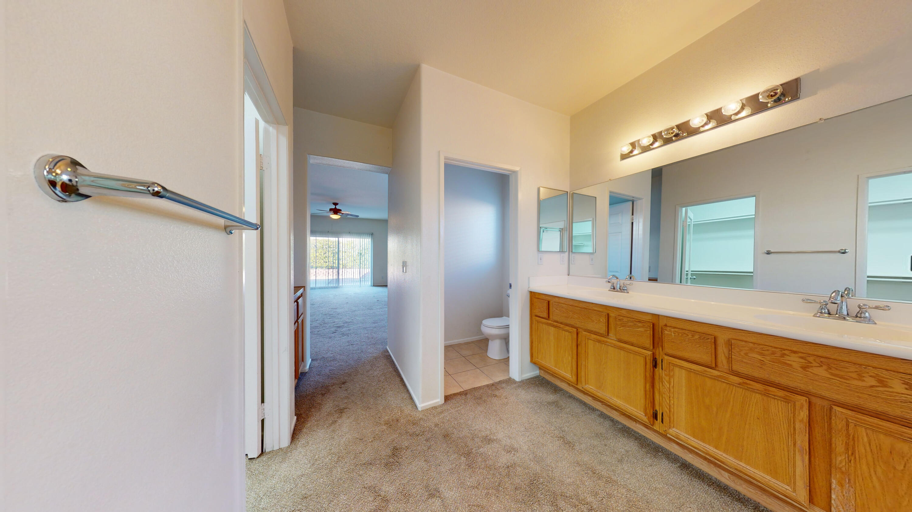 83276 Greenbrier Drive Indio, CA 92203 - Photo 8 of 12 a large bathroom with a double vanity sink and a mirror