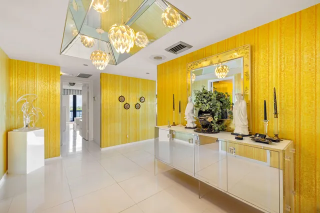 a view of a very nice looking dining room with a large window