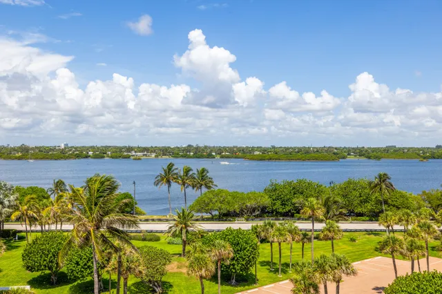 a view of a large pool with an ocean view