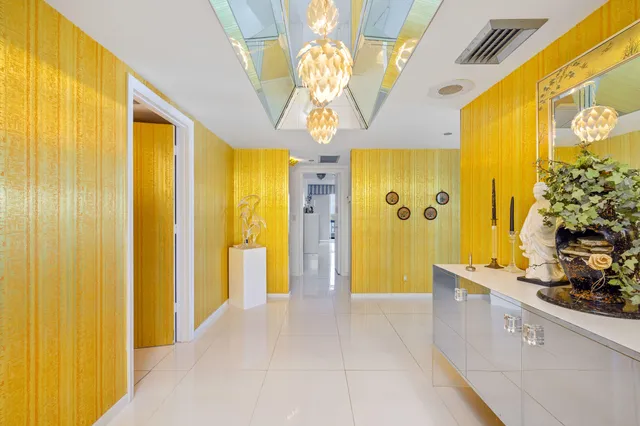 a spacious bathroom with a granite countertop shower a mirror and a bathtub