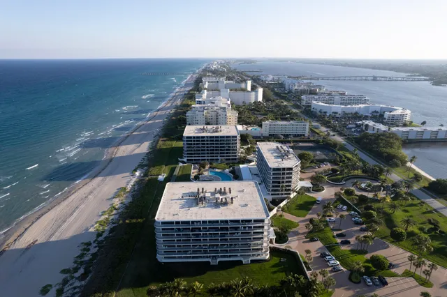 an aerial view of a house with a swimming pool