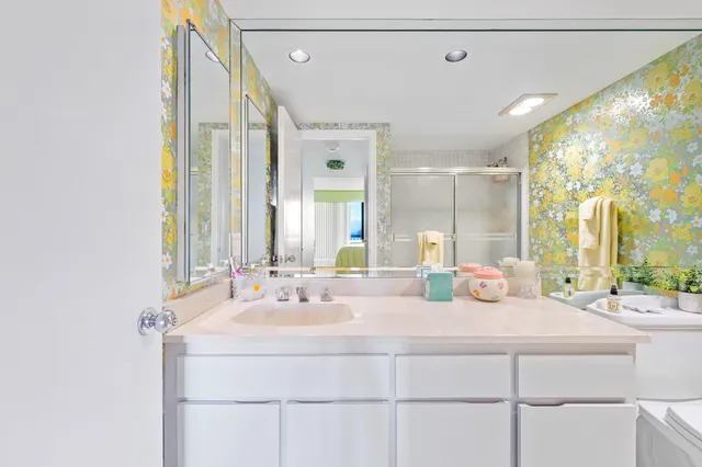 a bedroom with a bed and a night stand