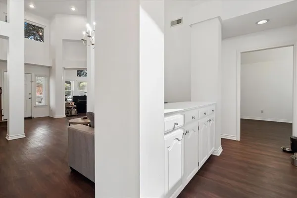 a view of hallway with wooden floor