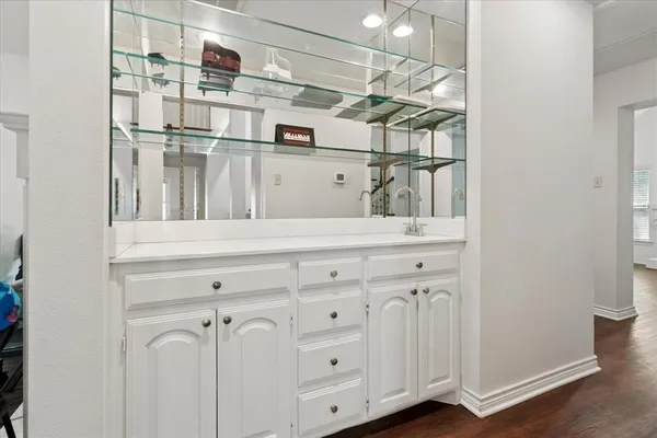 a view of a kitchen with cabinets