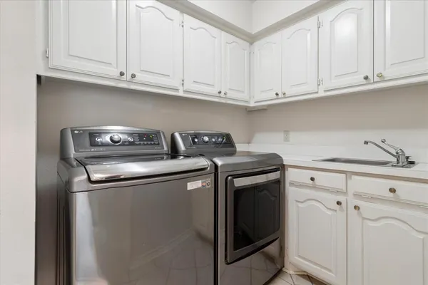 a kitchen with stainless steel appliances granite countertop a sink and cabinets