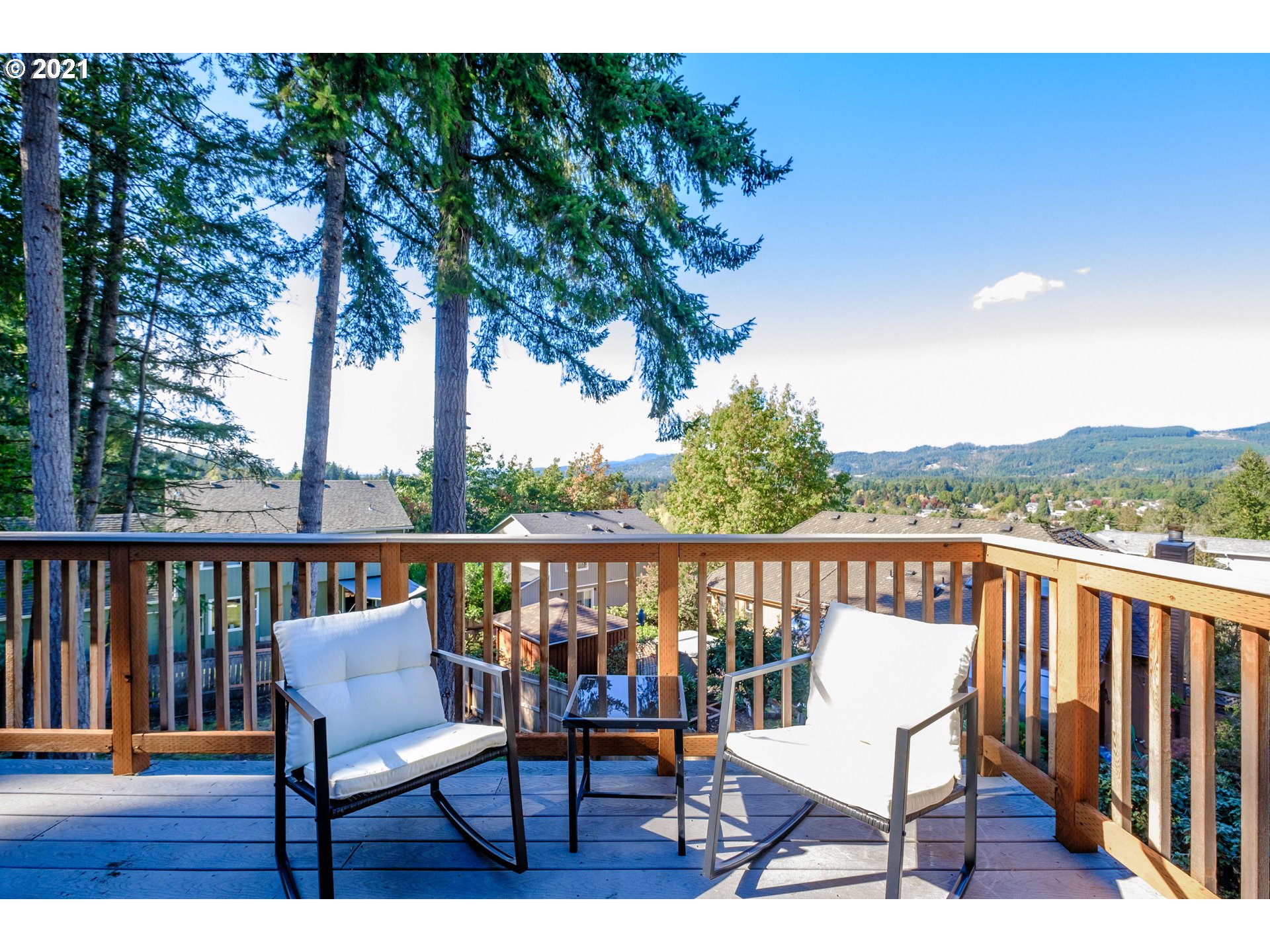 7249 Daisy Street Springfield, OR 97478 - Photo 6 of 32 a view of a balcony with wooden floor and bench