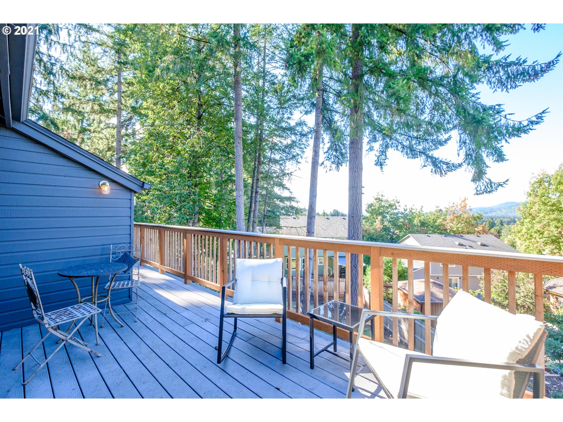 7249 Daisy Street Springfield, OR 97478 - Photo 7 of 32 a view of a balcony with wooden floor and outdoor seating