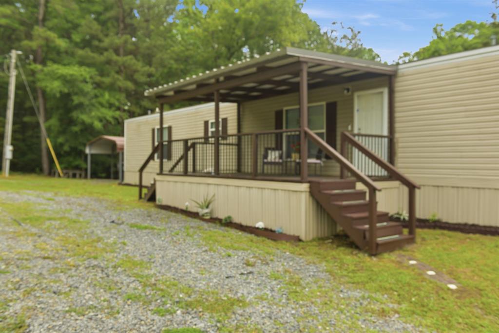 127 Almond Road Minden, LA 71055 - Photo 3 of 25 a view of wooden house with a park