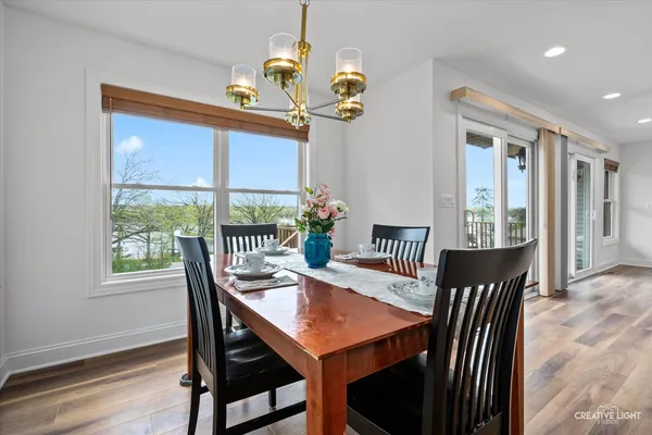 a view of a dining room with furniture window and outside view