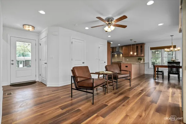 a living room with furniture and kitchen view