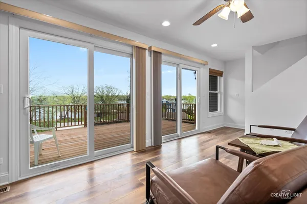 a living room with furniture and a floor to ceiling window