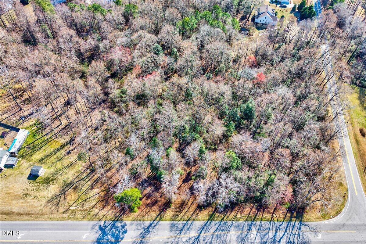 15973 Highway 210 Angier, NC 27501 - Photo 4 of 12 a view of a yard with a wooden fence