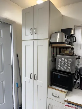 a kitchen with appliances and cabinets
