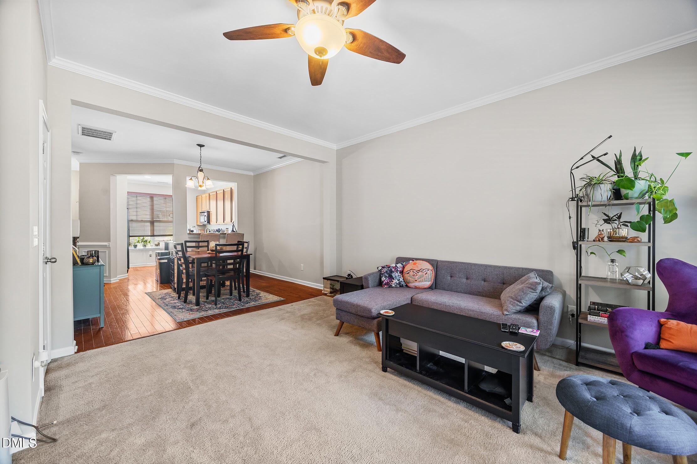 2940 Casona Way Raleigh, NC 27616 - Photo 12 of 23 a living room with furniture and wooden floor