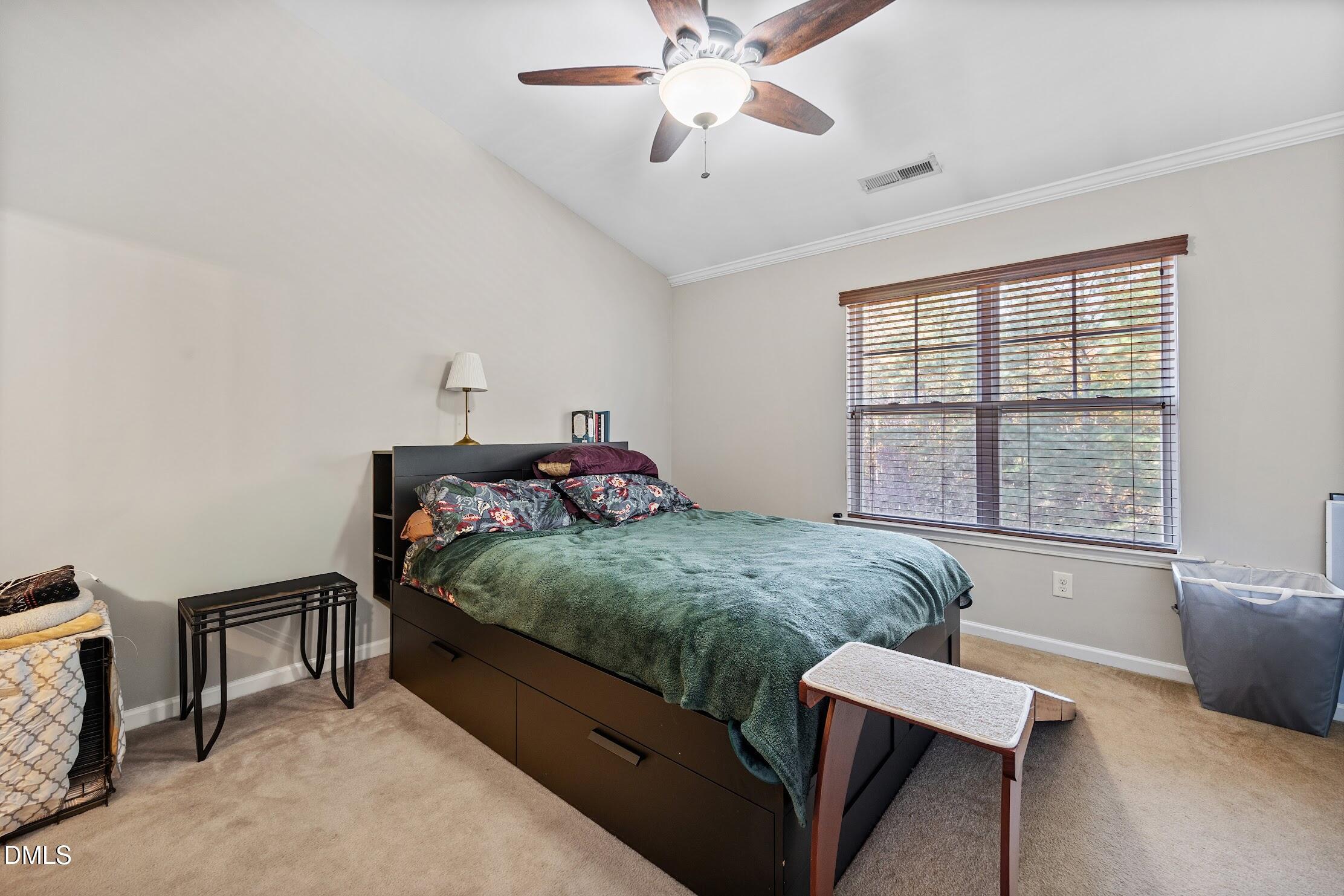 2940 Casona Way Raleigh, NC 27616 - Photo 18 of 23 a bedroom with a bed and a window