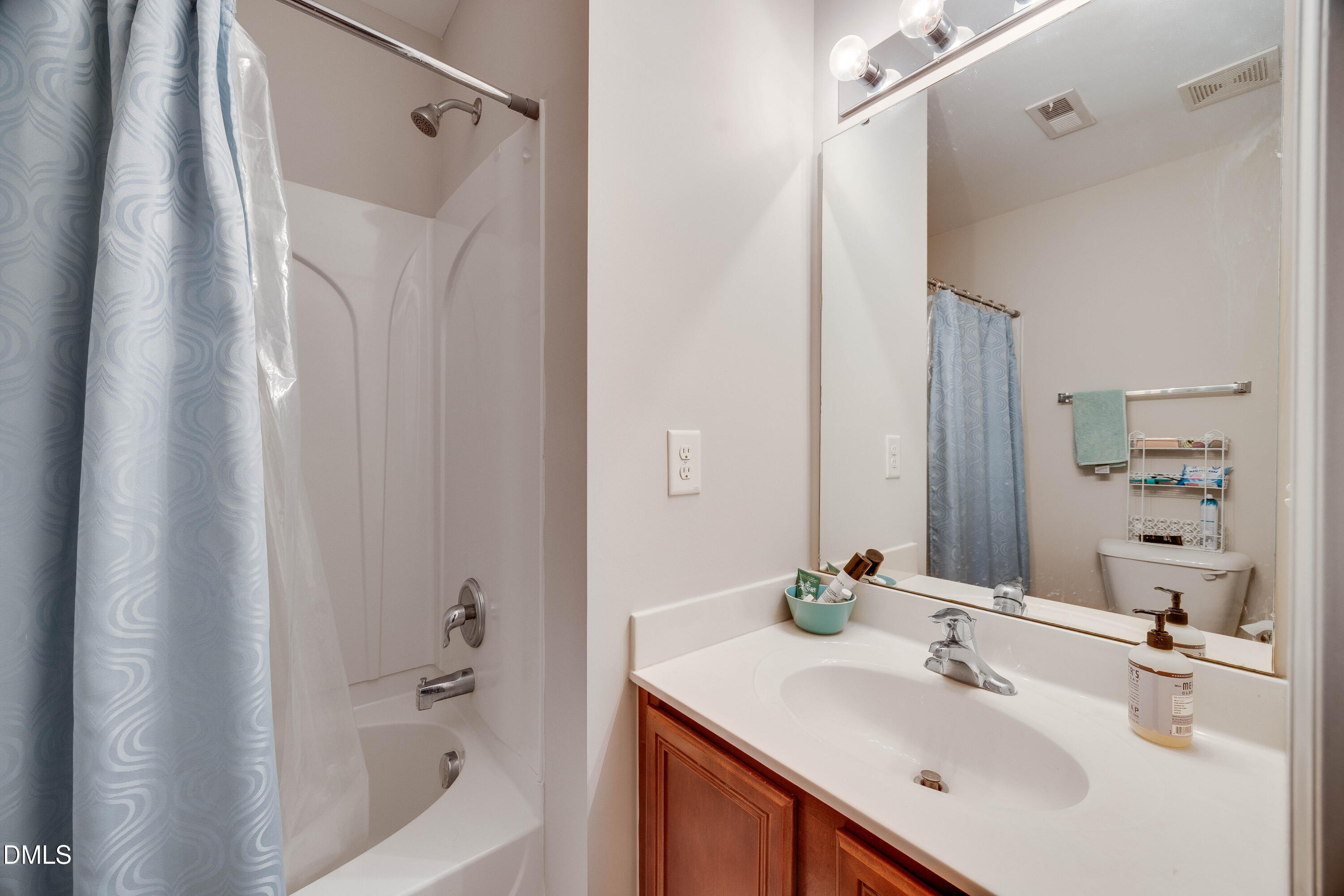 2940 Casona Way Raleigh, NC 27616 - Photo 22 of 23 a bathroom with a sink toilet and shower