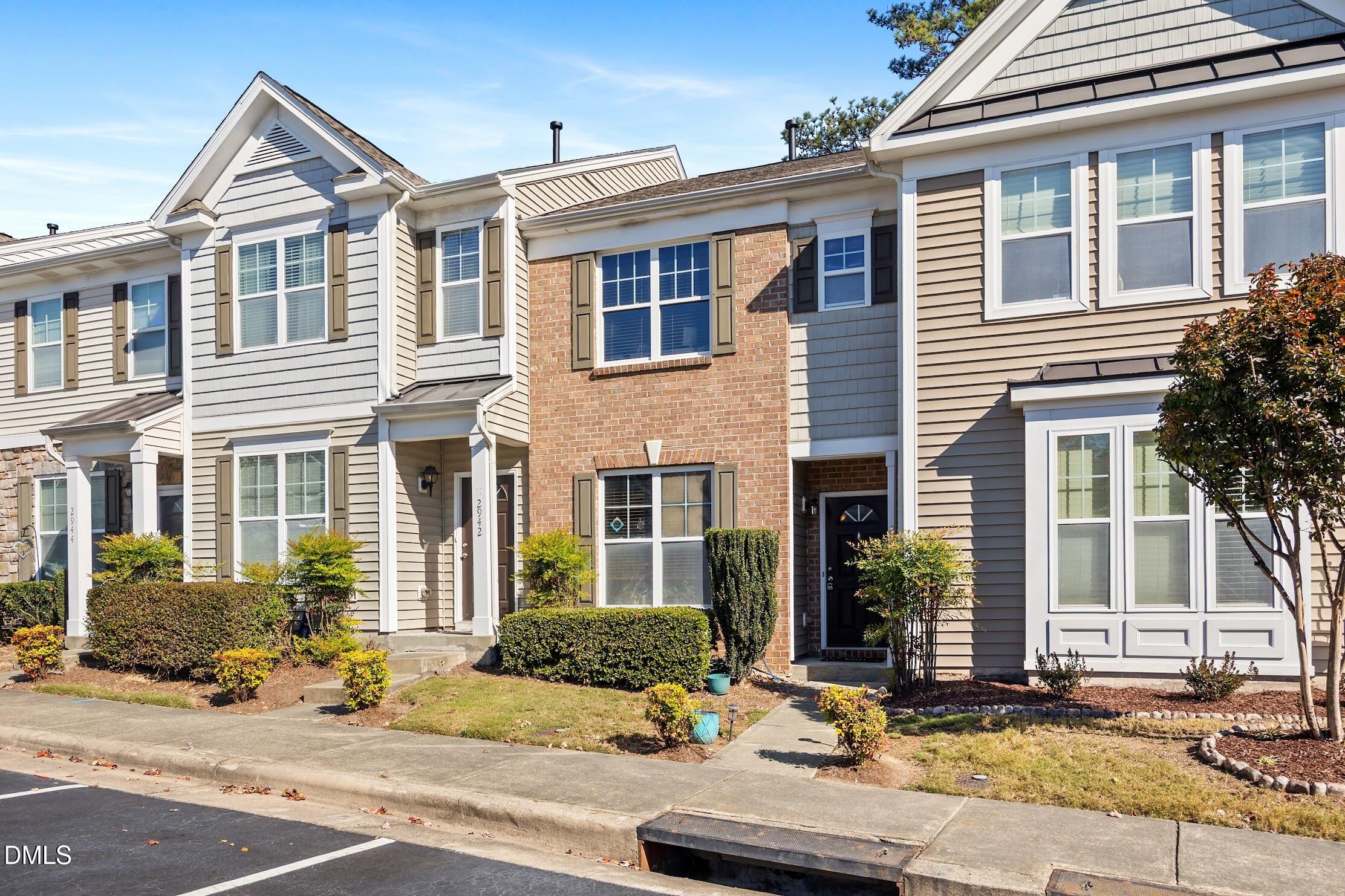 2940 Casona Way Raleigh, NC 27616 - Photo 2 of 23 a front view of a house with a yard