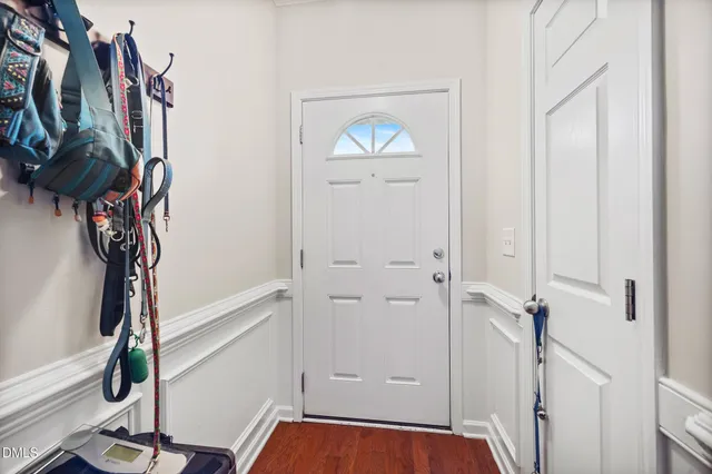 a view of a hallway with paintings on the wall