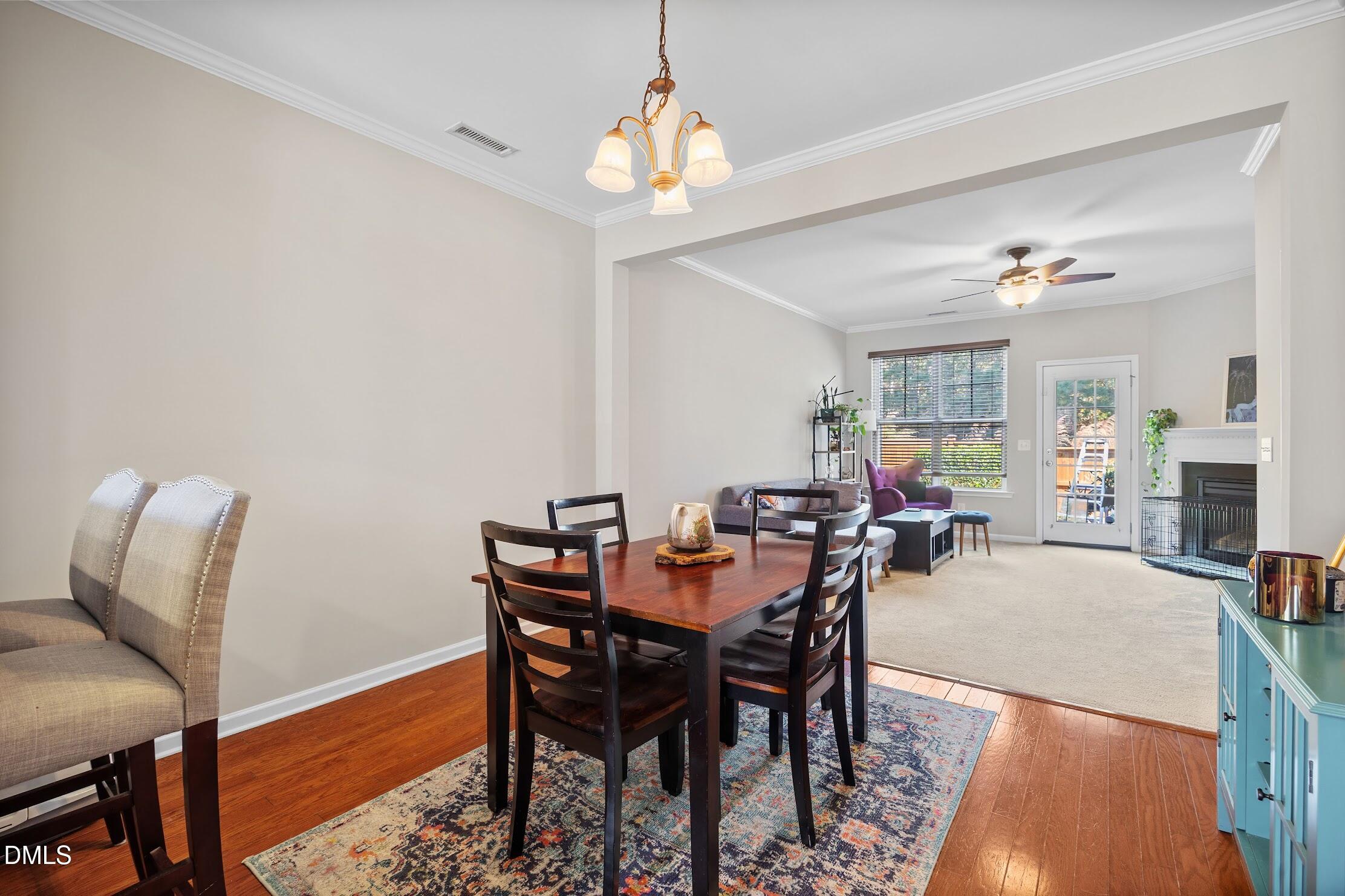 2940 Casona Way Raleigh, NC 27616 - Photo 8 of 23 a view of a dining room with furniture and wooden floor