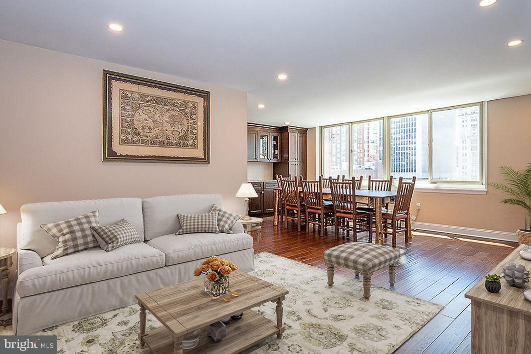 1919 Chestnut Street, Unit 807 Philadelphia, PA 19103 - Photo 1 of 25 a living room with furniture and wooden floor