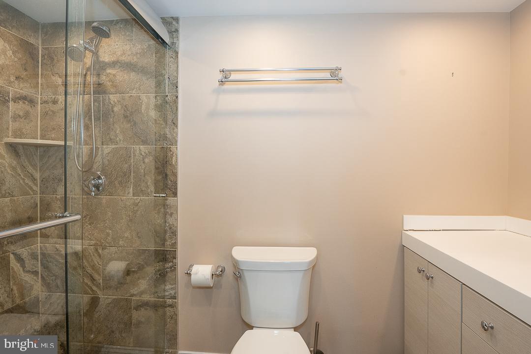 1919 Chestnut Street, Unit 807 Philadelphia, PA 19103 - Photo 11 of 25 a bathroom with a toilet and a shower