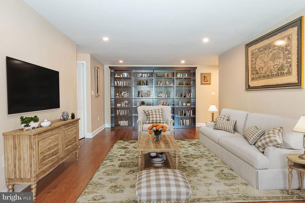 1919 Chestnut Street, Unit 807 Philadelphia, PA 19103 - Photo 2 of 25 a living room with furniture and a flat screen tv