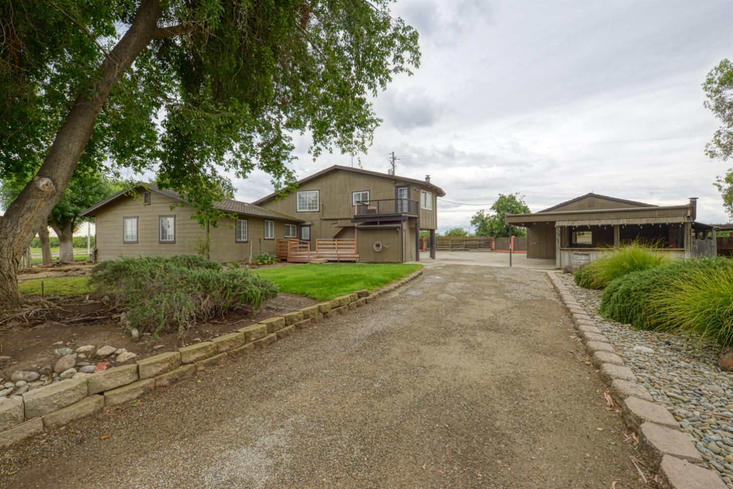 2931 East Marshall Road Patterson, CA 95363 - Photo 8 of 54 View of home and detached garage with attached Tiki Bar