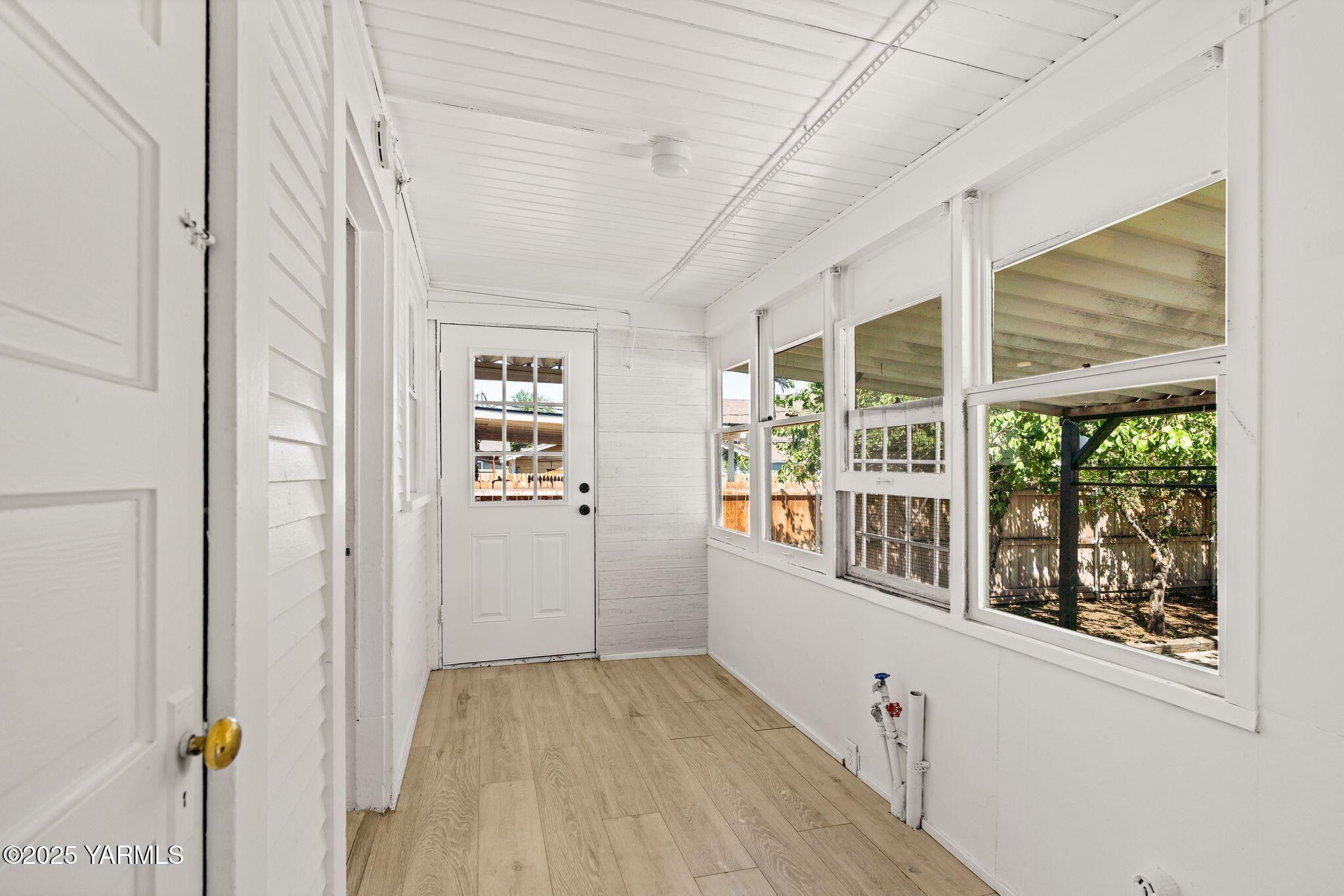 705 South 8th Avenue Yakima, WA 98902 - Photo 14 of 25 a view of an entryway with wooden floor
