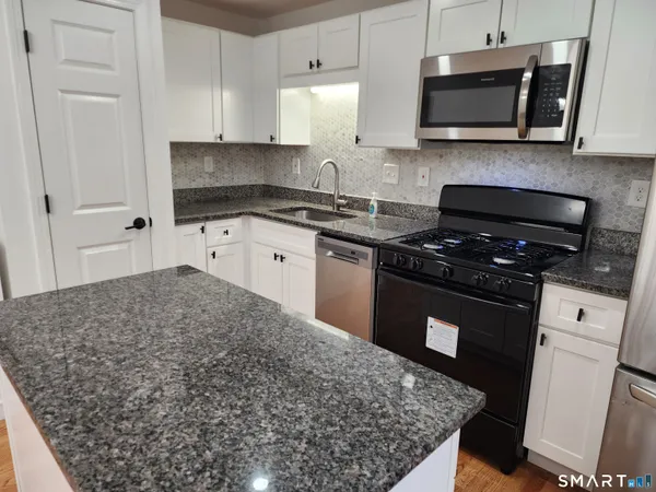 a view of a kitchen with a sink