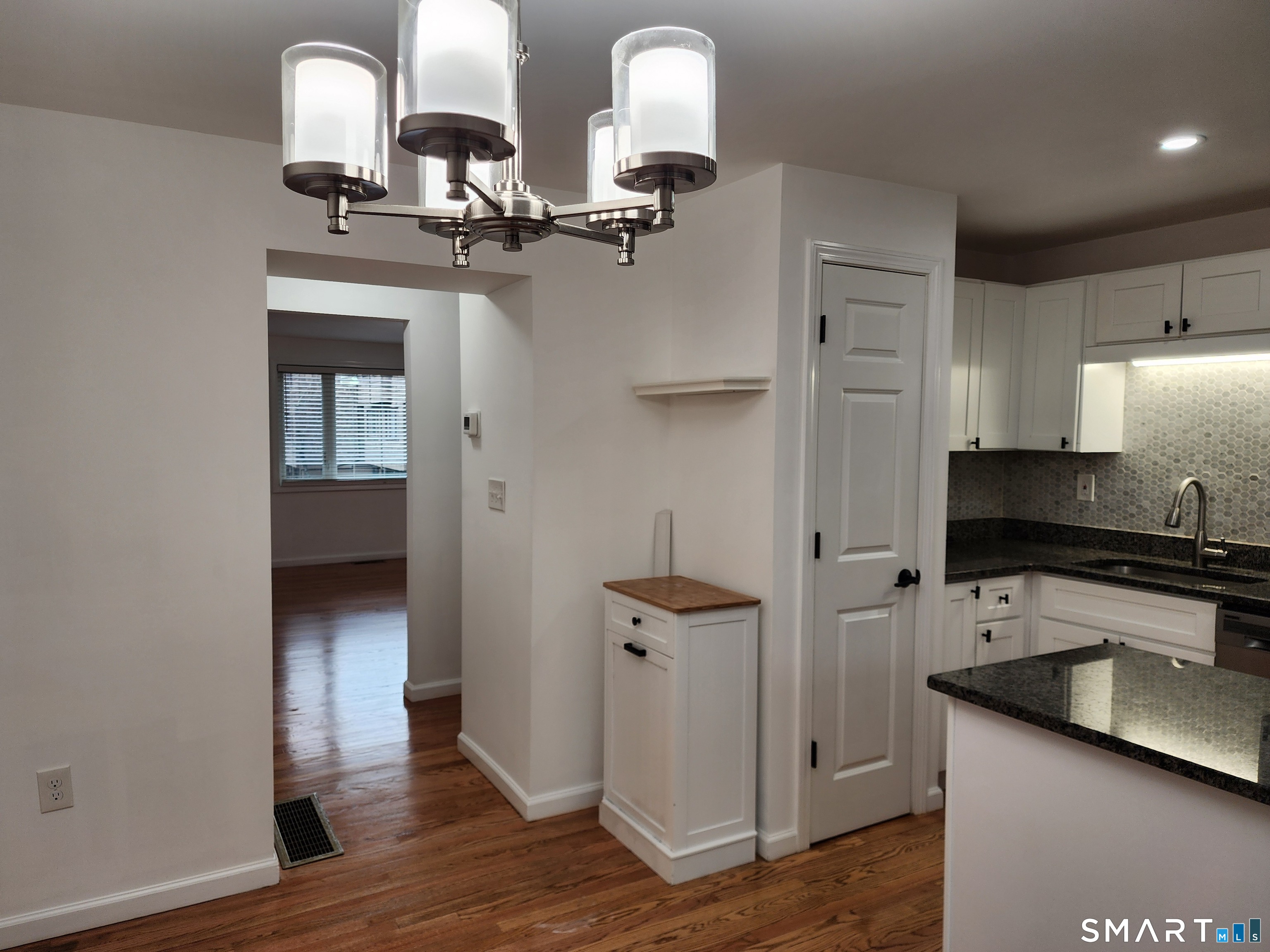 71 Towne House Road, Unit 71 Hamden, CT 06514 - Photo 14 of 32 a kitchen with stainless steel appliances granite countertop a sink and a refrigerator