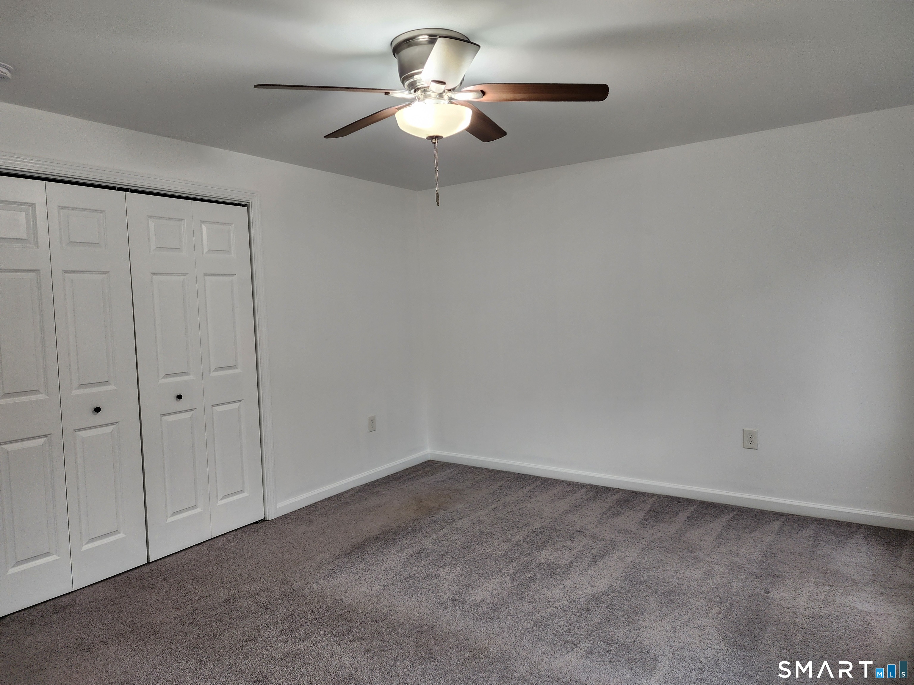 71 Towne House Road, Unit 71 Hamden, CT 06514 - Photo 22 of 32 a view of a big room with chandelier fan