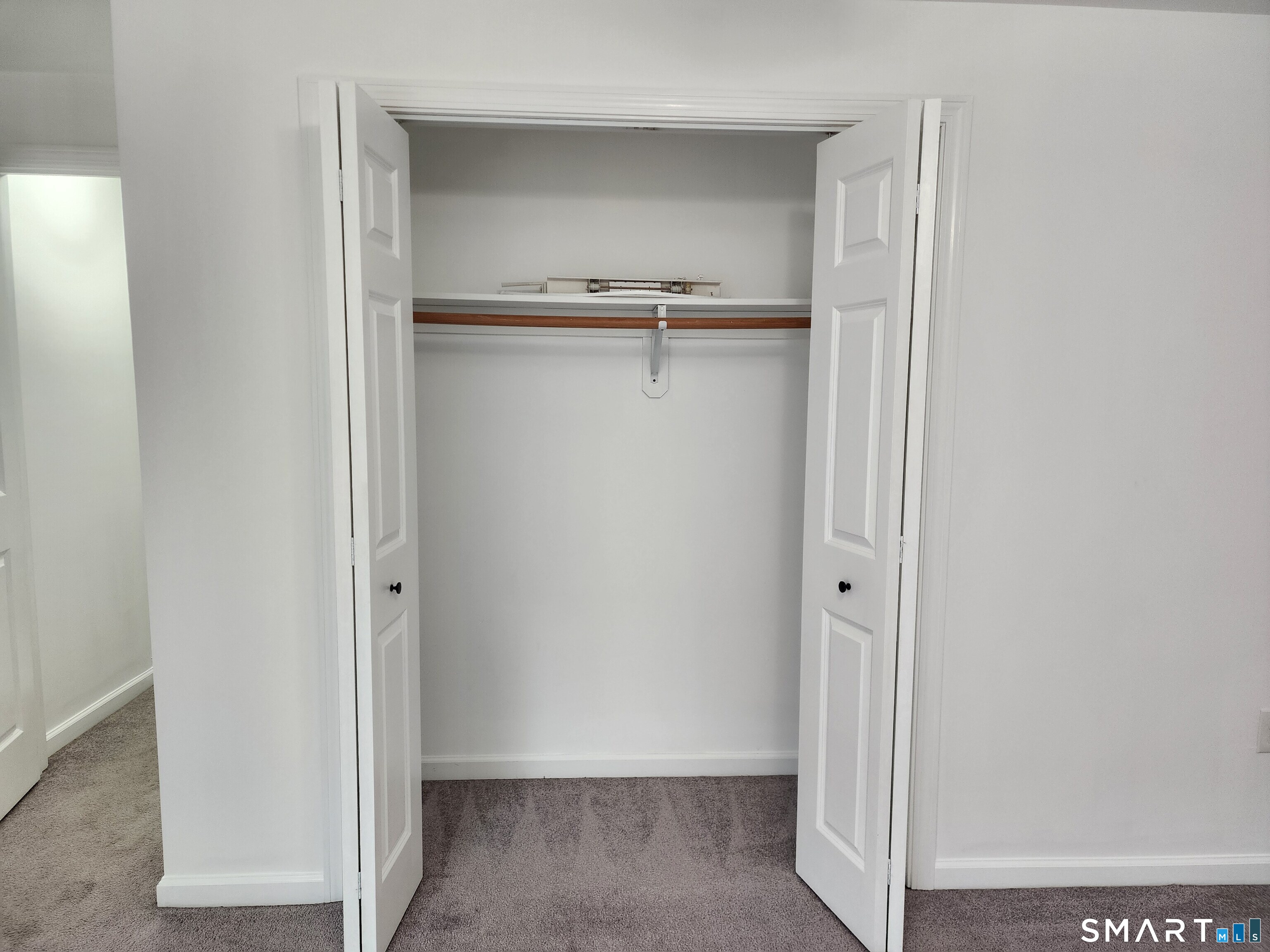 71 Towne House Road, Unit 71 Hamden, CT 06514 - Photo 23 of 32 a view of an empty walk in closet