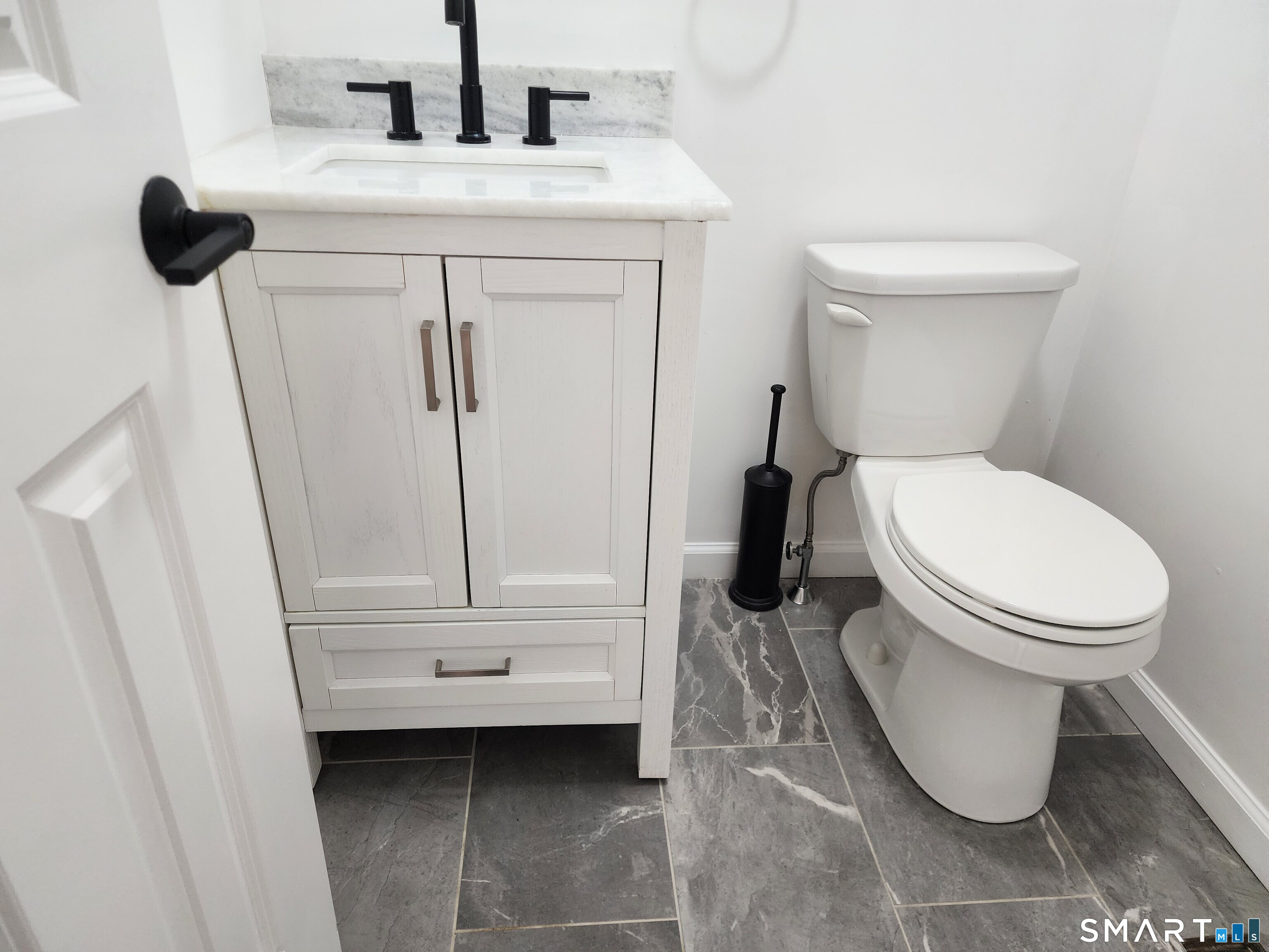 71 Towne House Road, Unit 71 Hamden, CT 06514 - Photo 6 of 32 a bathroom with a toilet and a sink
