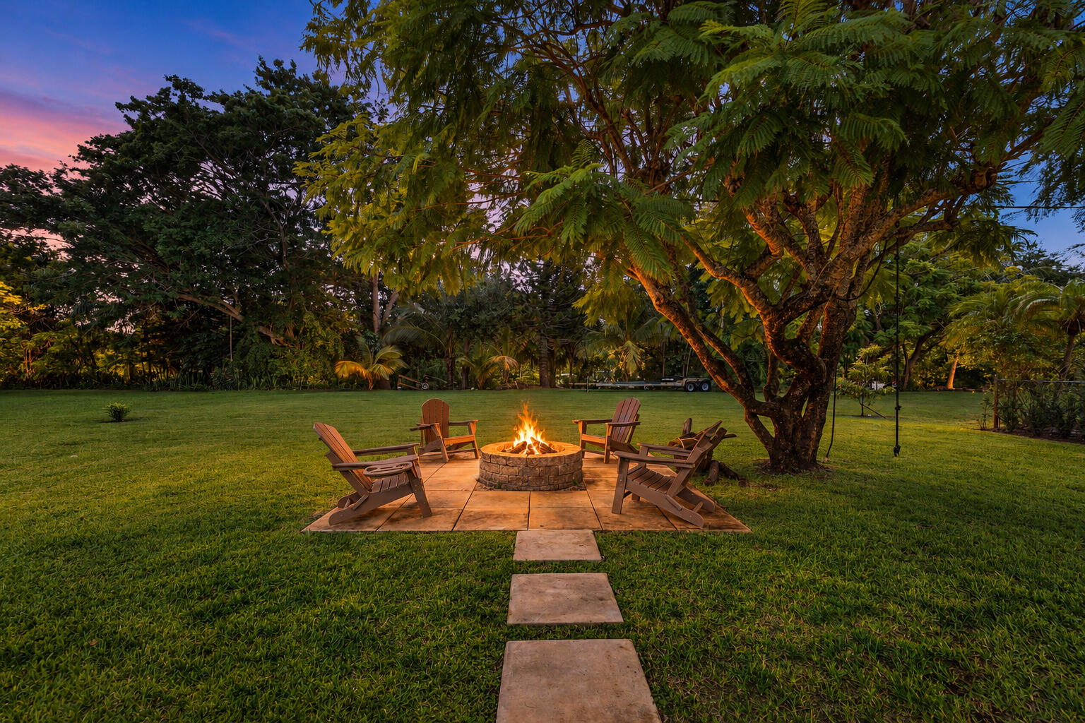 949 Laurel Road North Palm Beach, FL 33408 - Photo 32 of 53 949_Laurel_Road_Fire_Pit_036_Twilight