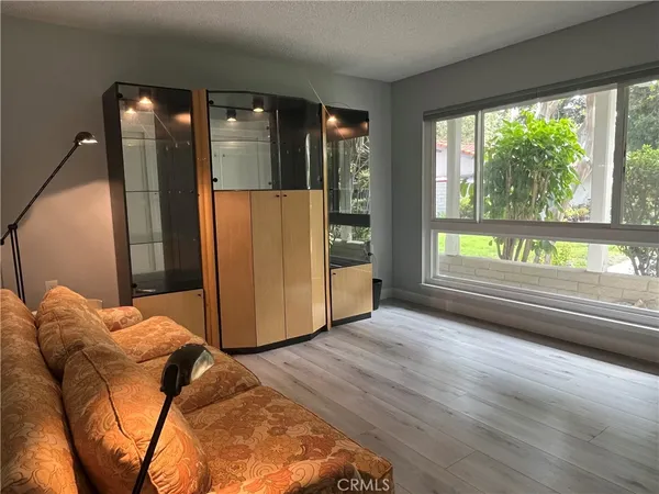 a kitchen with stainless steel appliances a refrigerator a sink a stove and cabinets