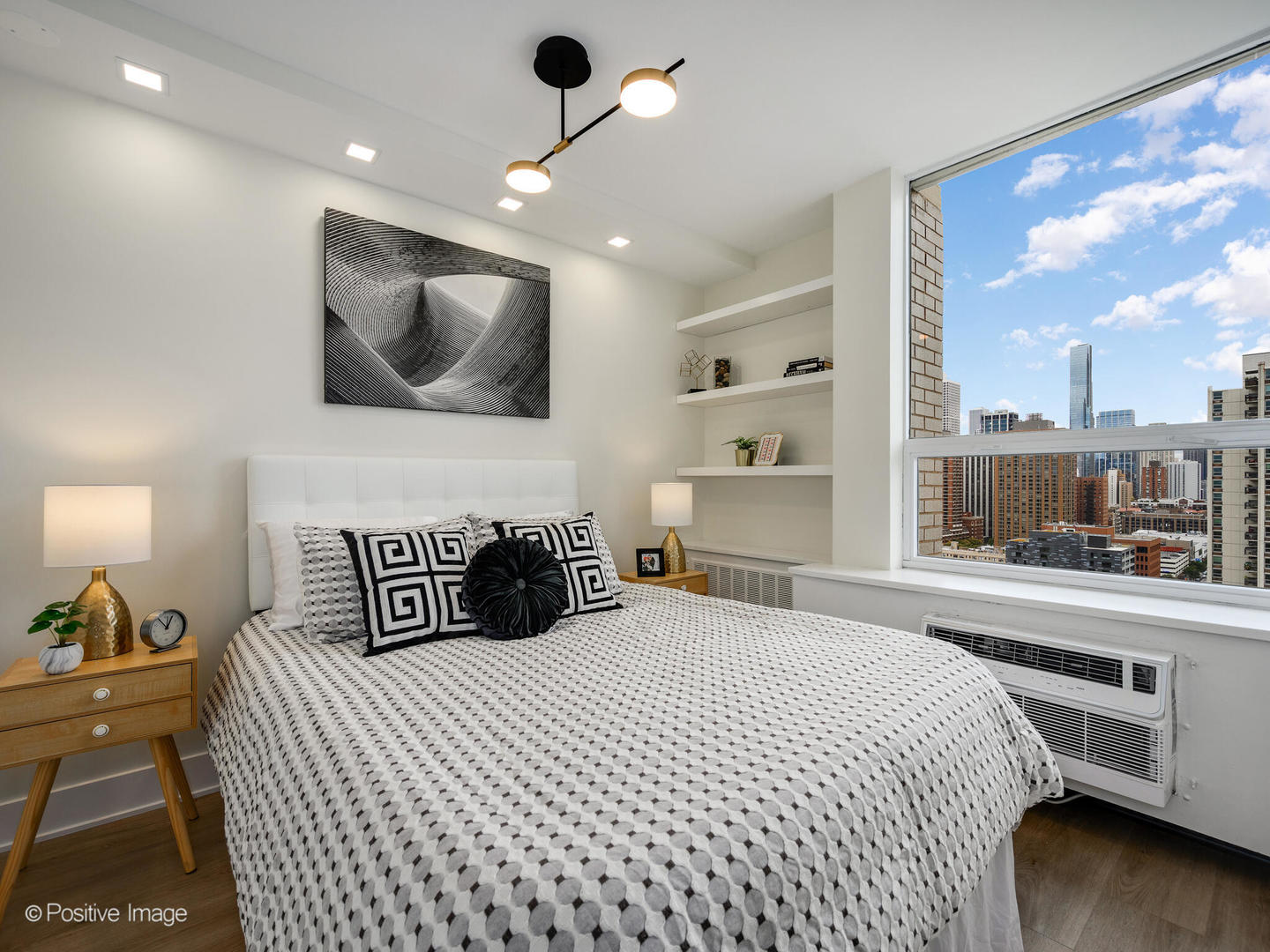 1355 North Sandburg Terrace, Unit 2201D Chicago, IL 60610 - Photo 17 of 44 a bedroom with a large bed and a large window