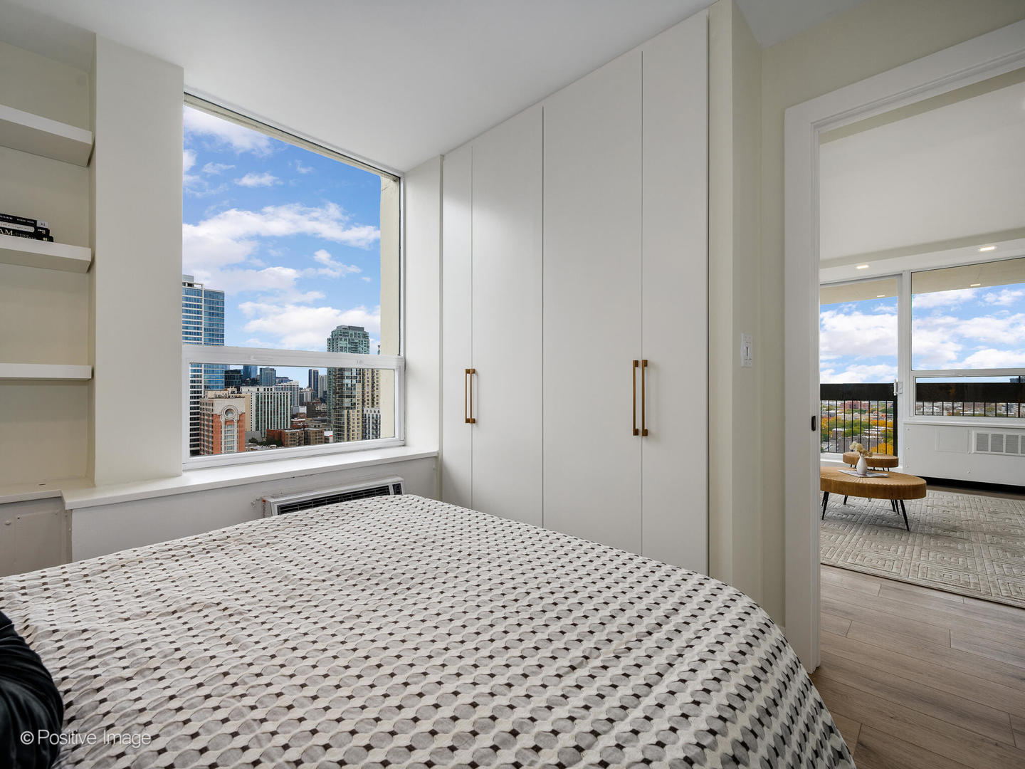 1355 North Sandburg Terrace, Unit 2201D Chicago, IL 60610 - Photo 24 of 44 a bedroom with a bed and a large window with outer view