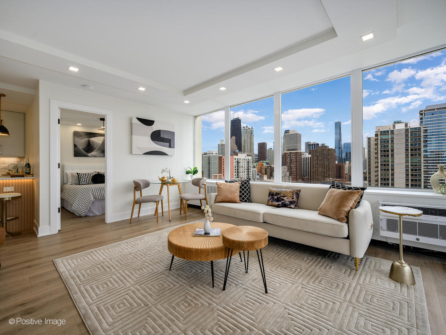 1355 North Sandburg Terrace, Unit 2201D Chicago, IL 60610 - Photo 6 of 44 a living room with furniture wooden floor and a large window