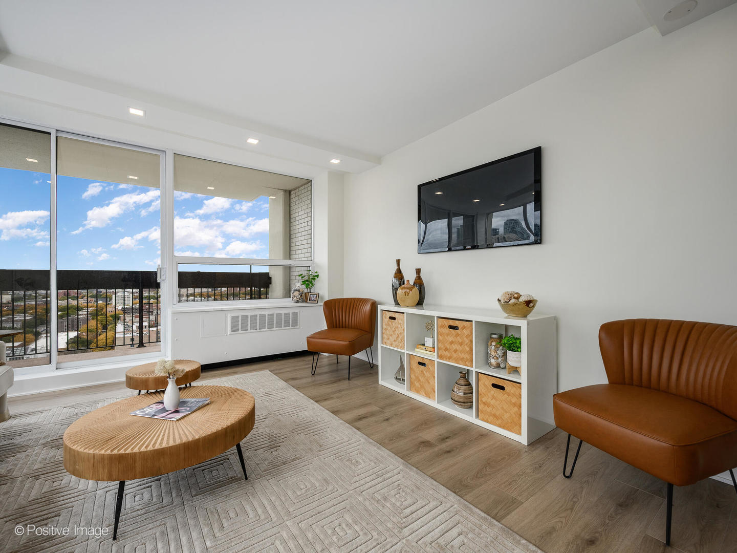 1355 North Sandburg Terrace, Unit 2201D Chicago, IL 60610 - Photo 8 of 44 a living room with furniture and a flat screen tv