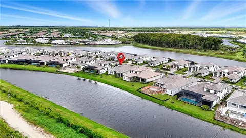 an aerial view of multiple houses with yard