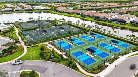 a view of a lake with houses in the back