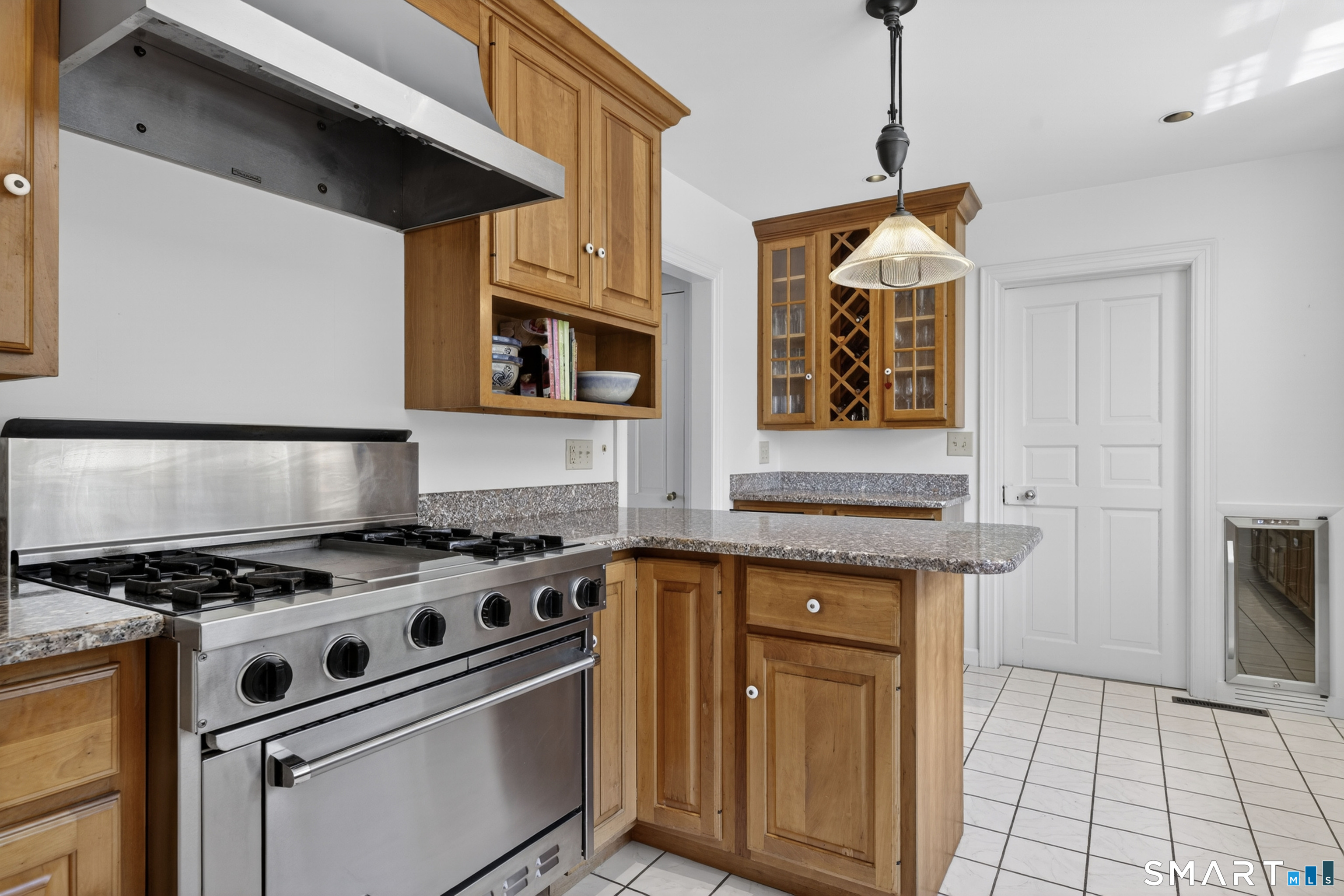 32 Money Point Road Stonington, CT 06355 - Photo 12 of 40 a kitchen with stainless steel appliances granite countertop a stove and a microwave