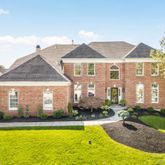 a front view of a house with swimming pool