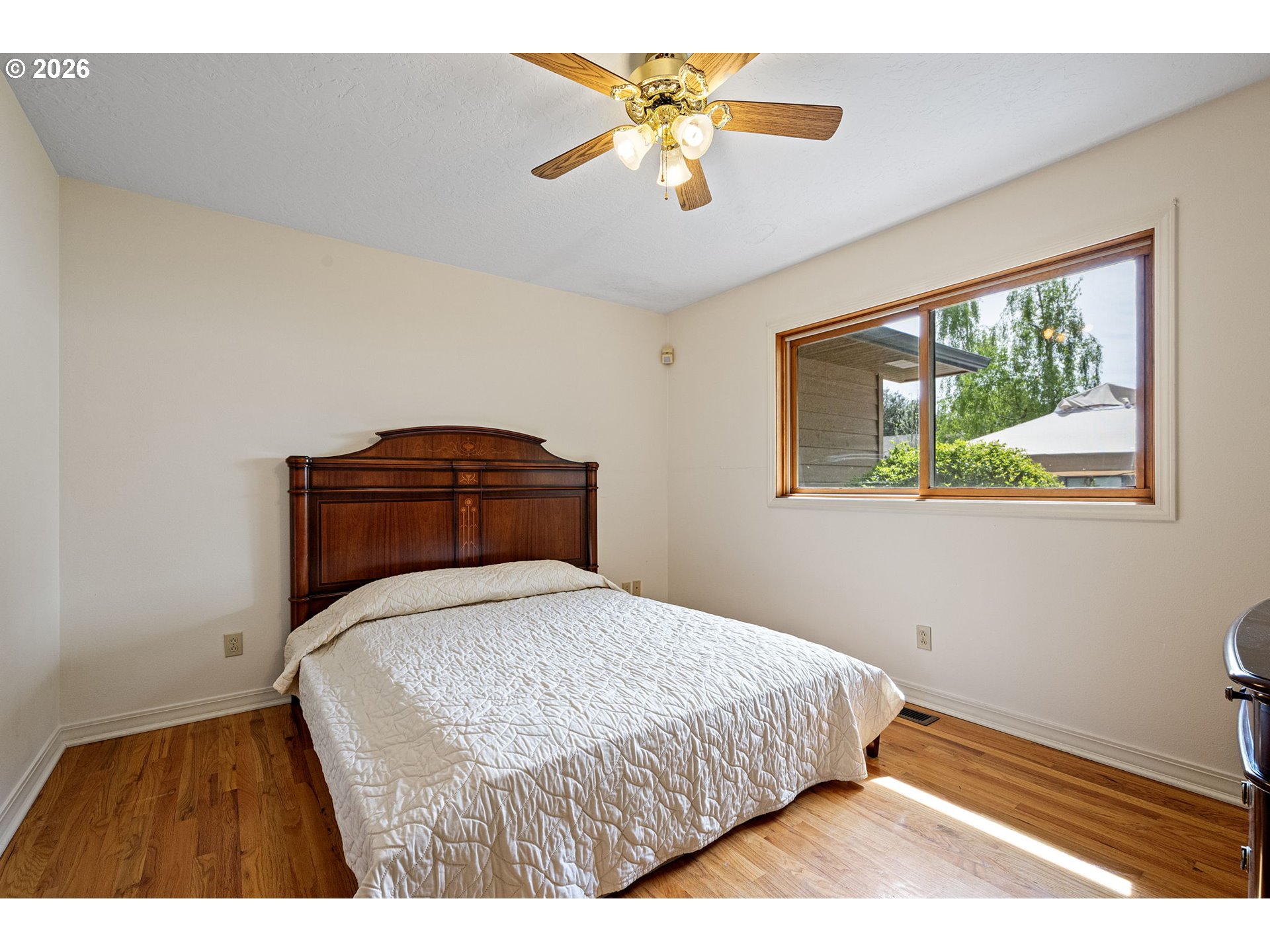 84 Green Lane Eugene, OR 97404 - Photo 21 of 41 a bedroom with a bed and a chandelier