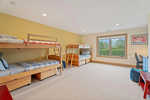 a bedroom with furniture and a window